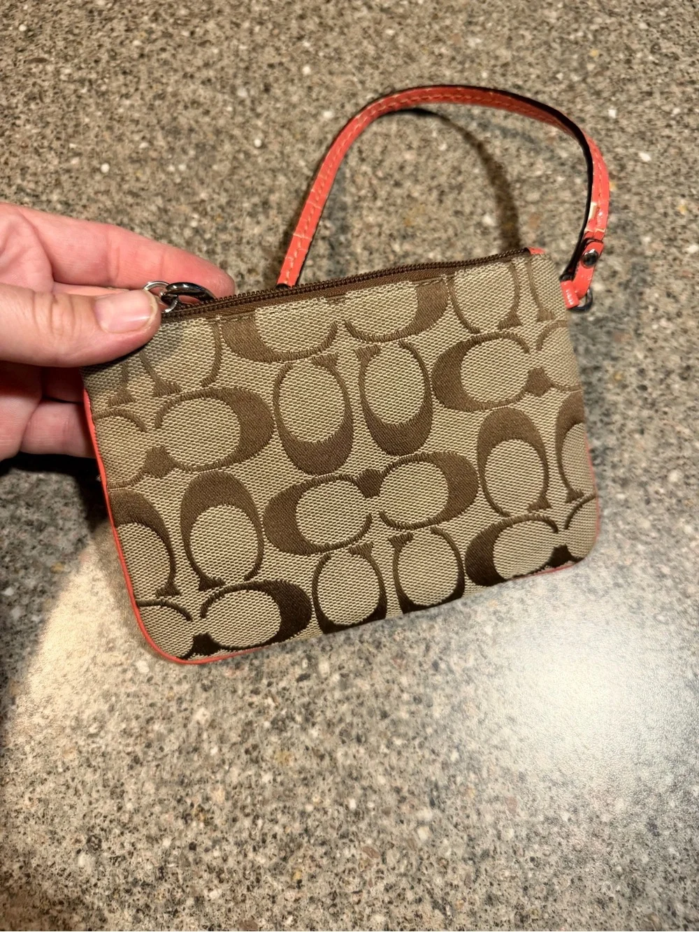 Coach Signature Monogram Wristlet in Brown and Coral